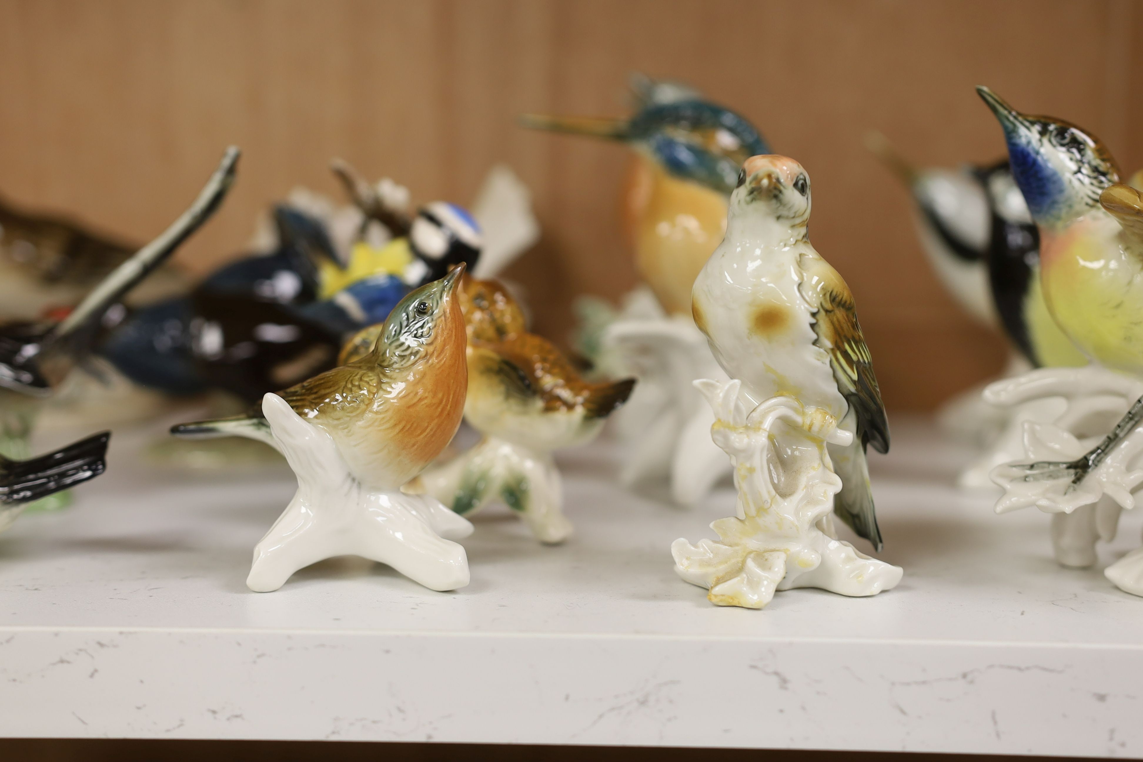 A large collection of ceramic bird figures including Beswick, Russian models, Karl Ens etc